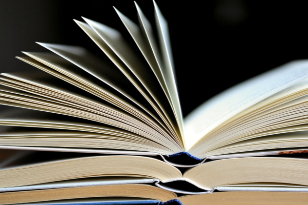 InnerSelf Magazine: June 2, 2025 A stack of open books on top of each other. Image by congerdesign from Pixabay.